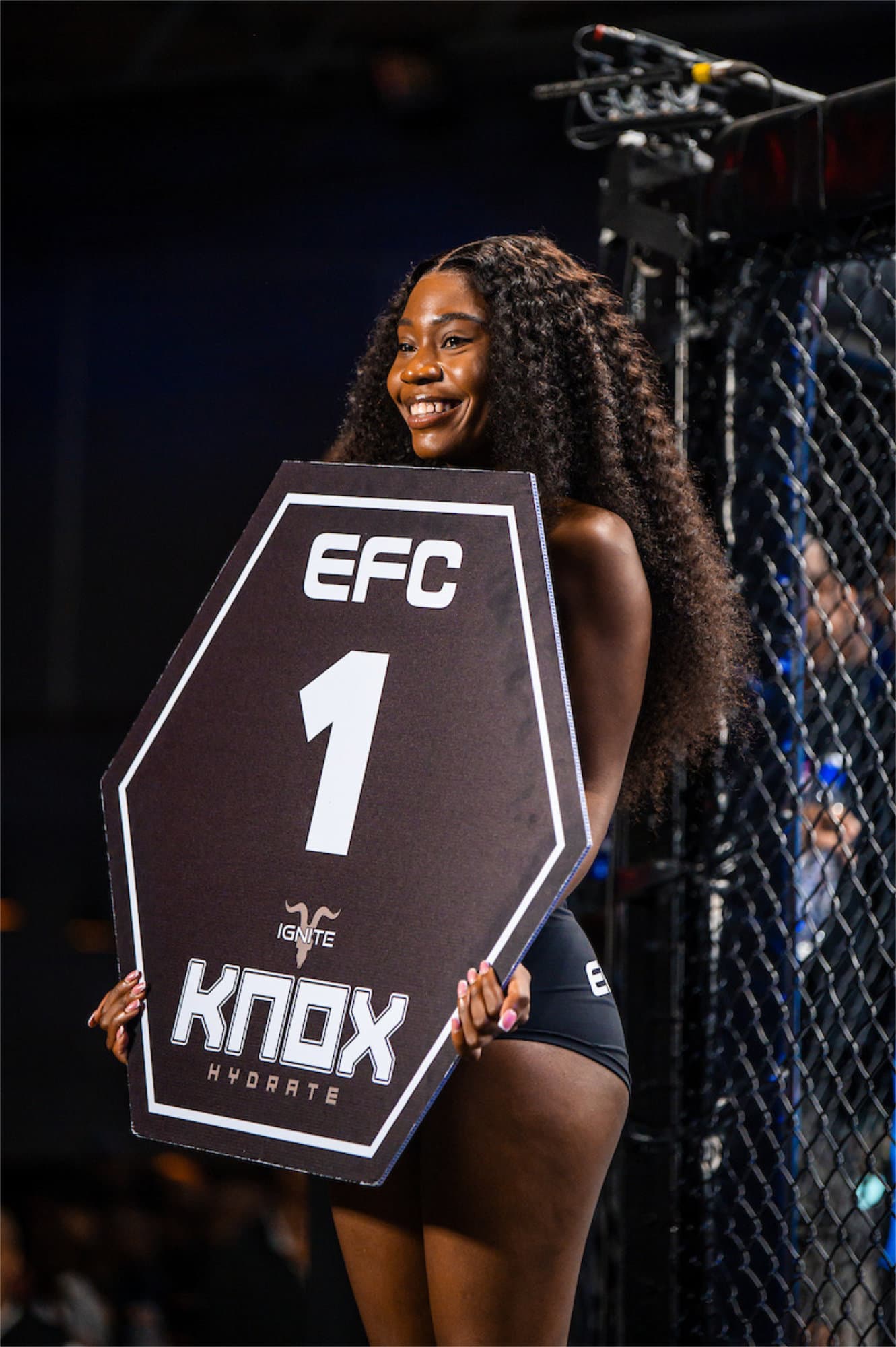 EFC ring girl holding round card at a Championship event