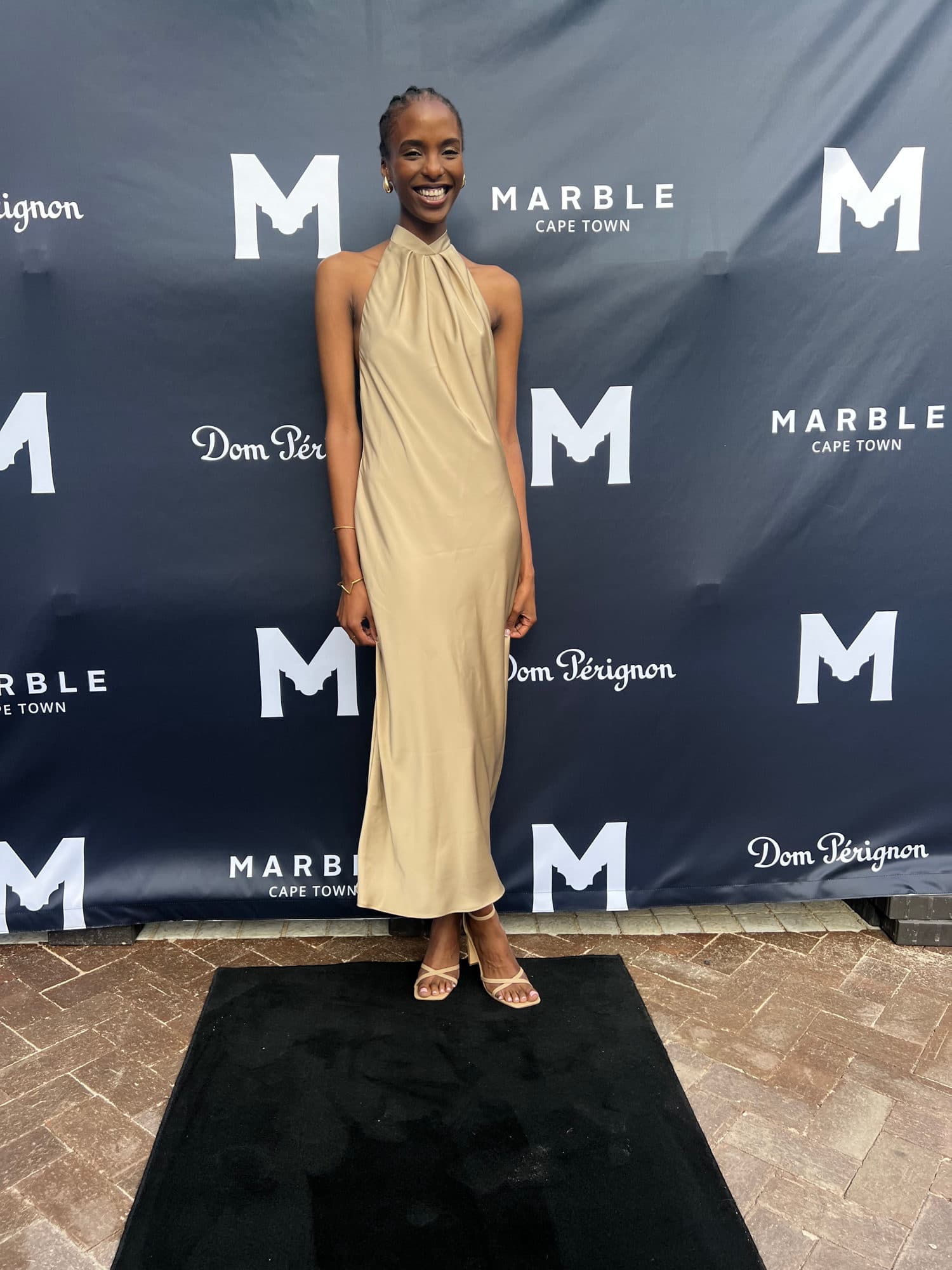 Hostess welcoming guests at a private Marble restaurant event