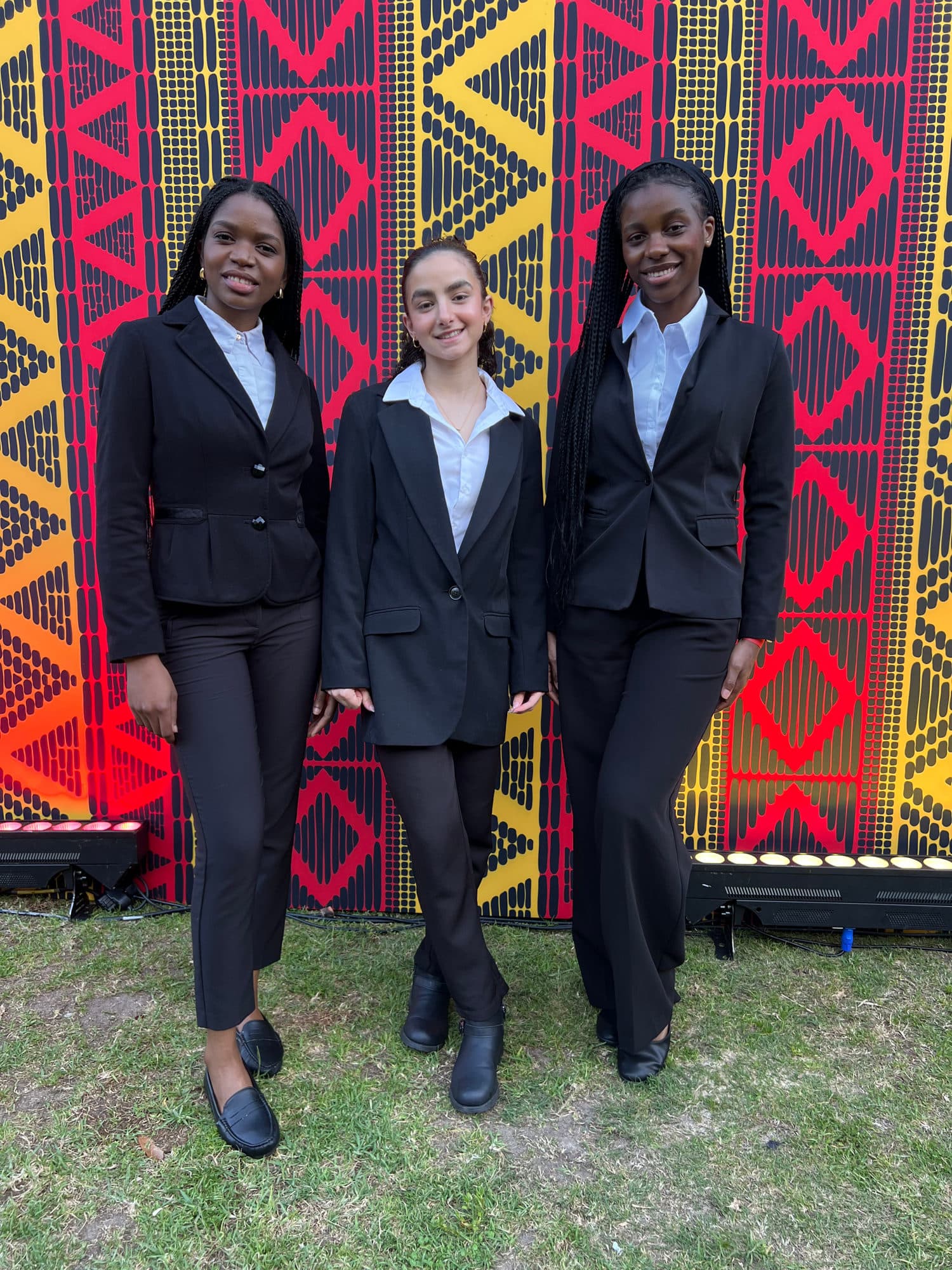 Shell team with African print backdrop at event