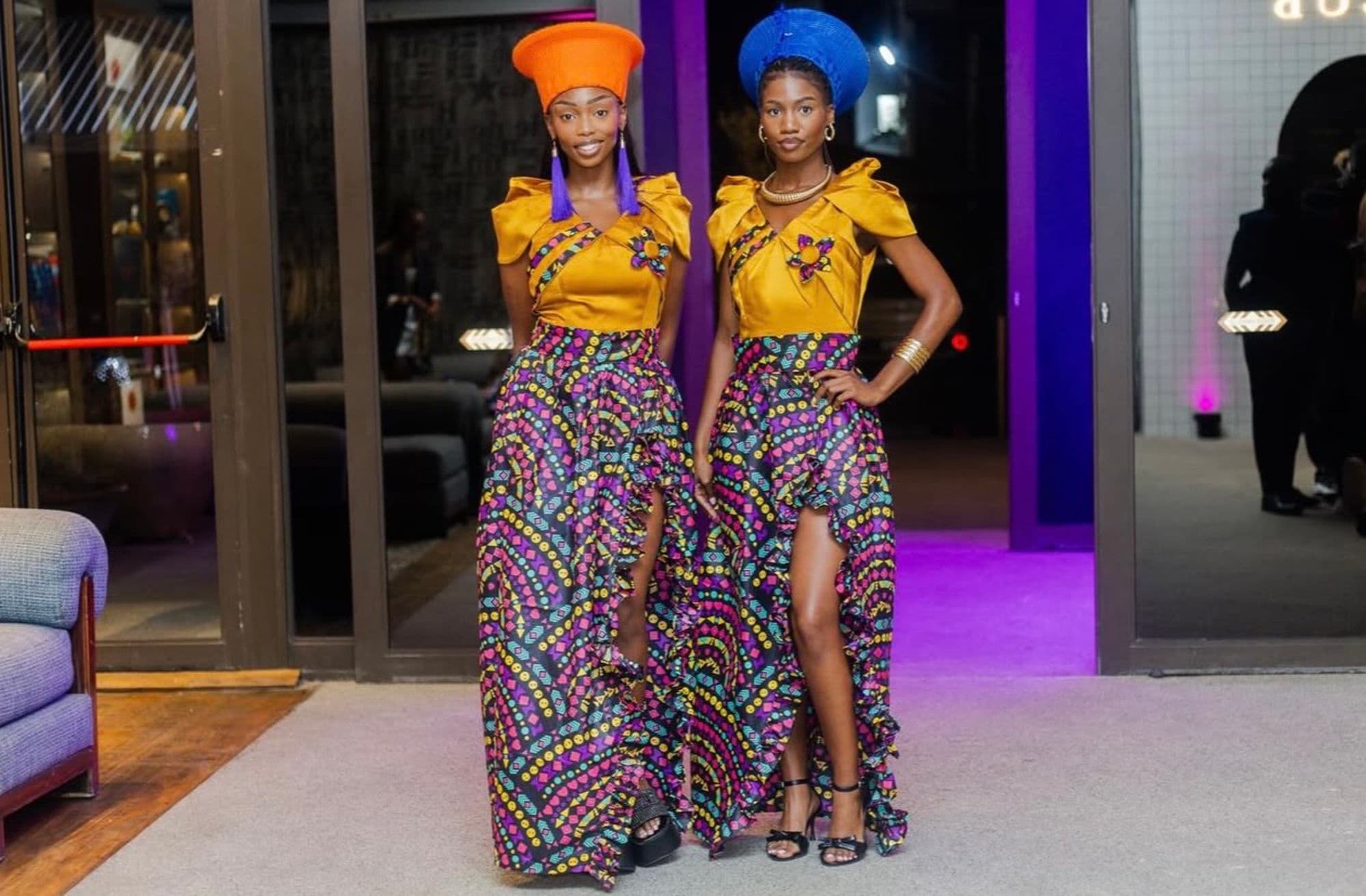 Two performers in African attire at an evening event