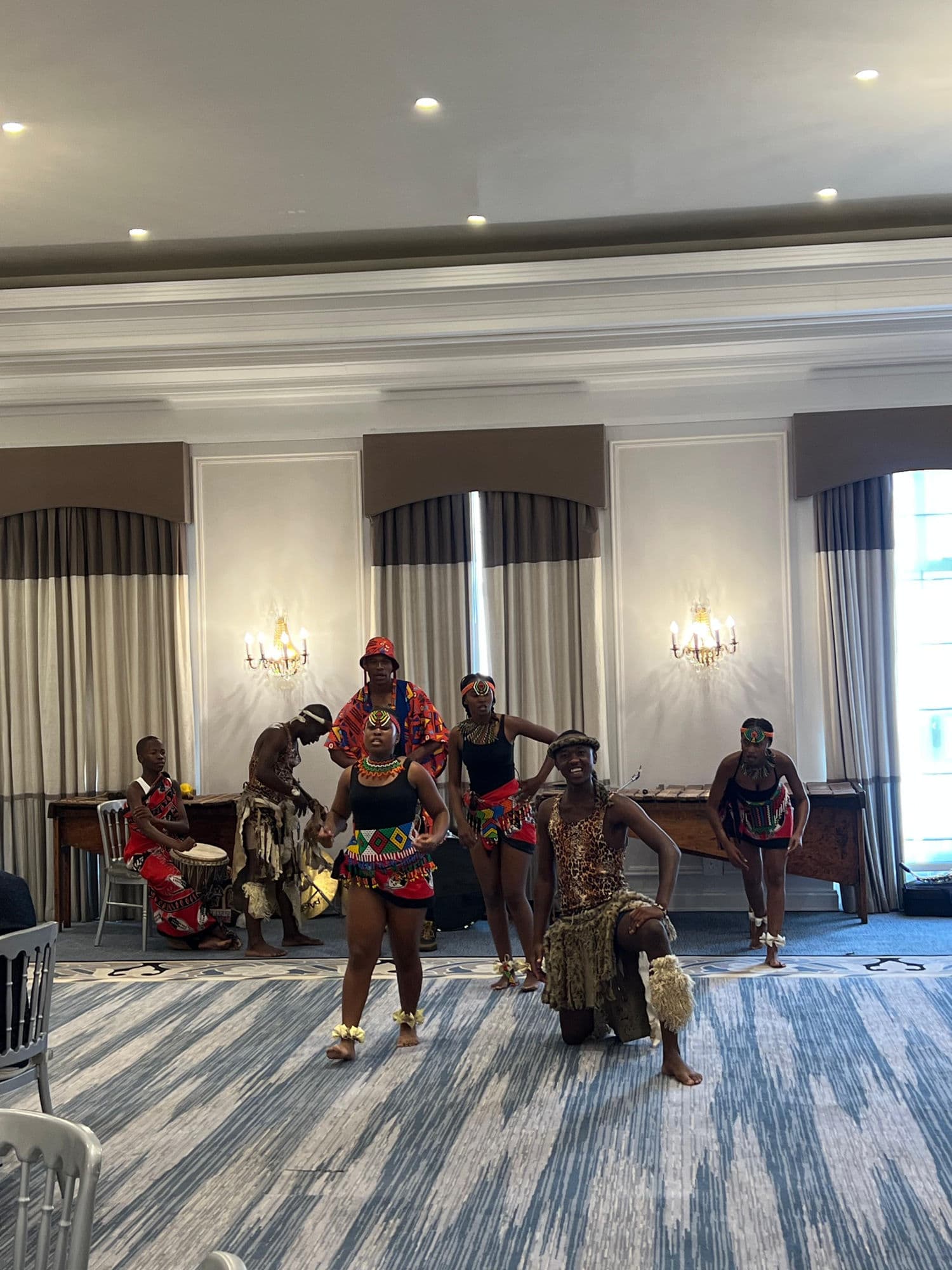 African dance troupe performing at a corporate venue